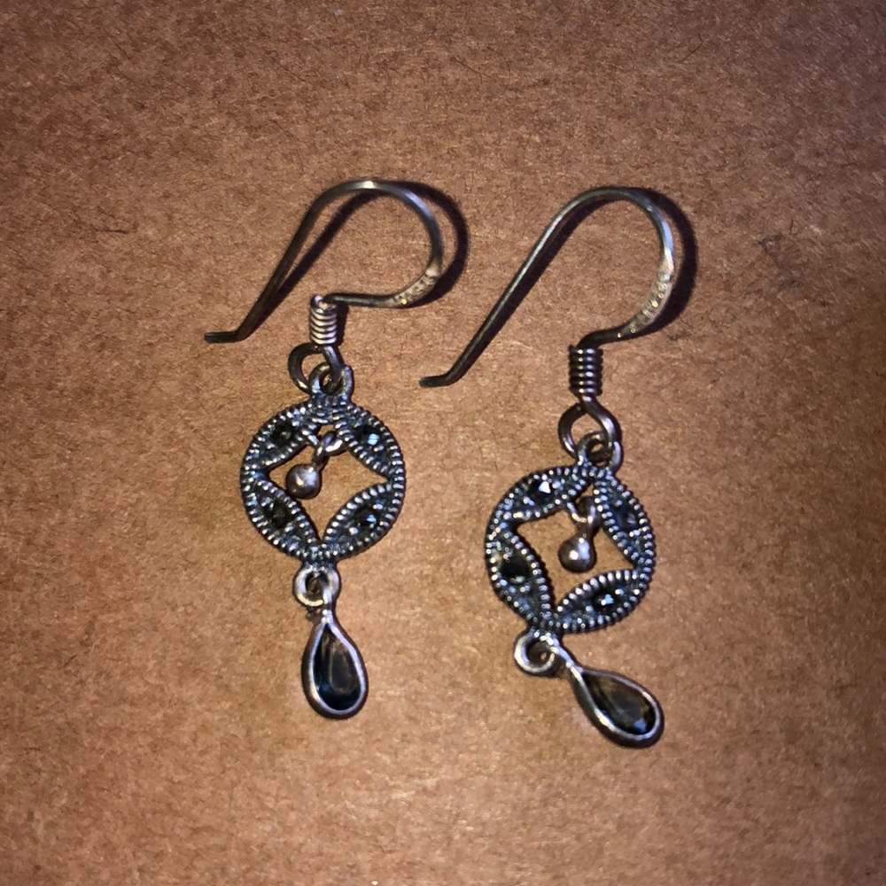 Silver dangle earrings.
